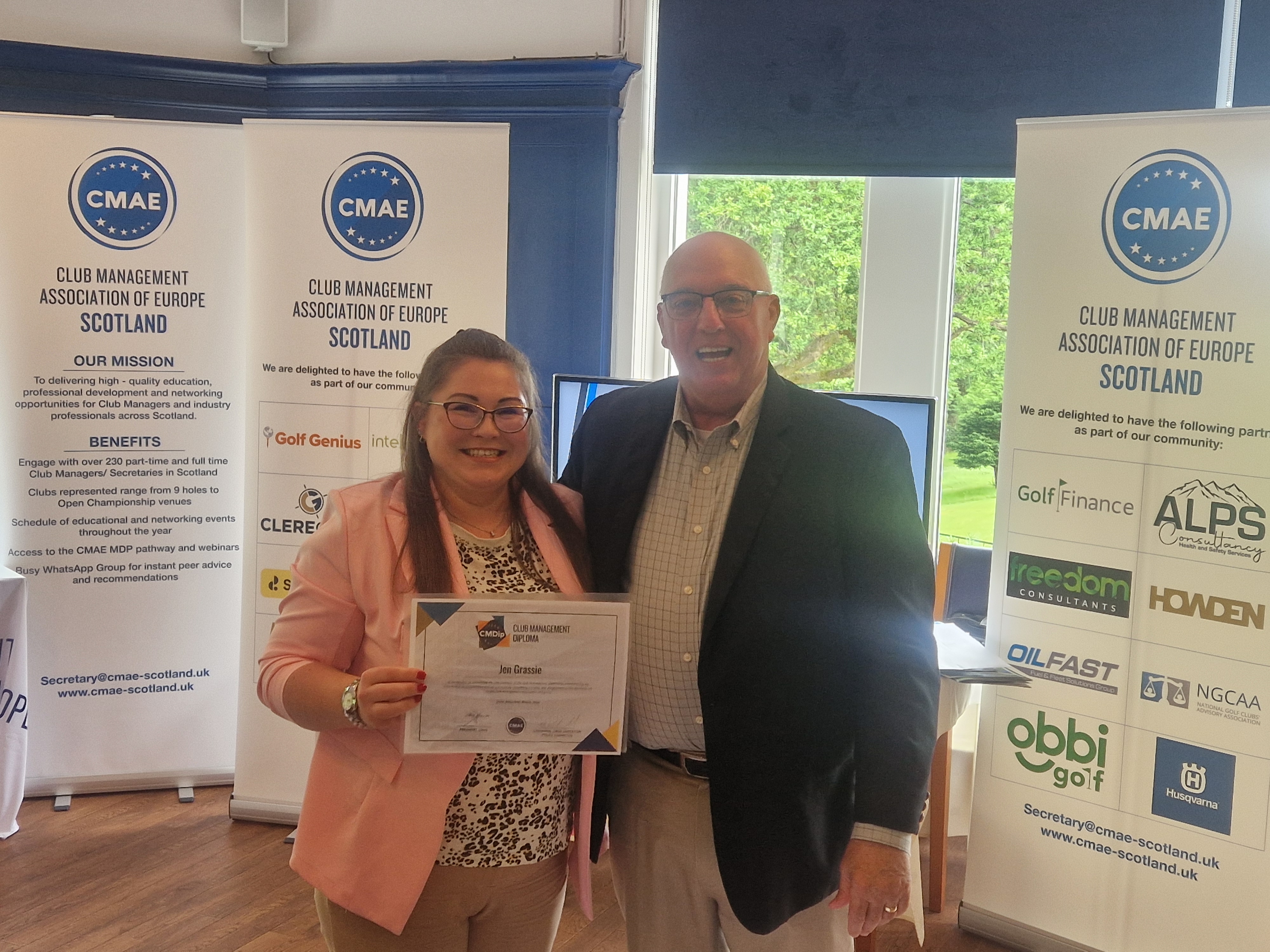 Jen Grassie receiving her CMDip certificate from Steve Graves